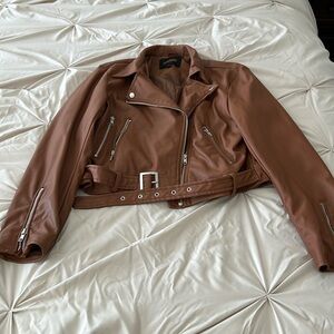 Brown pleather jacket. Hardly worn.